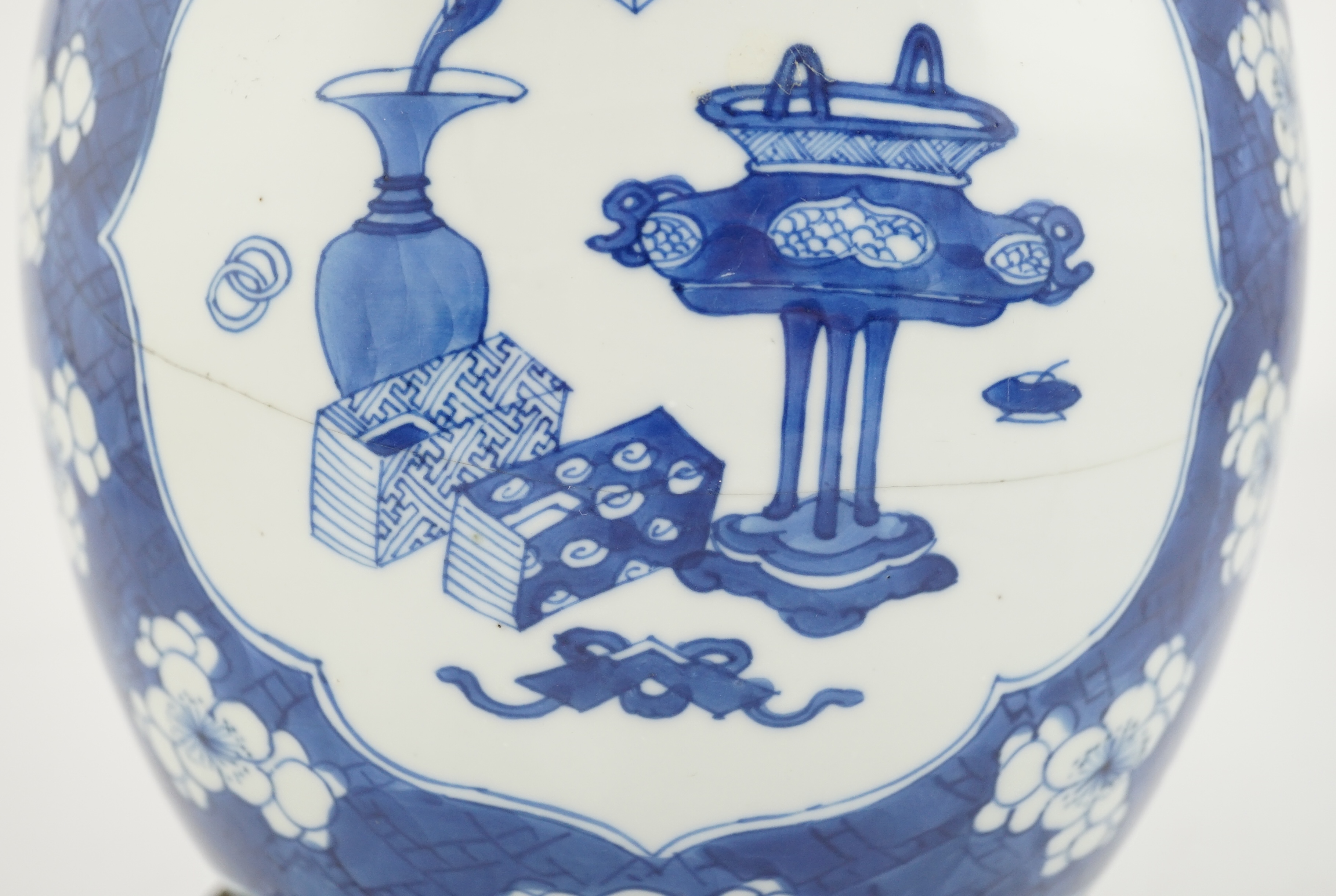 A Chinese blue and white ‘Antiques’ jar, Kangxi period, cracked